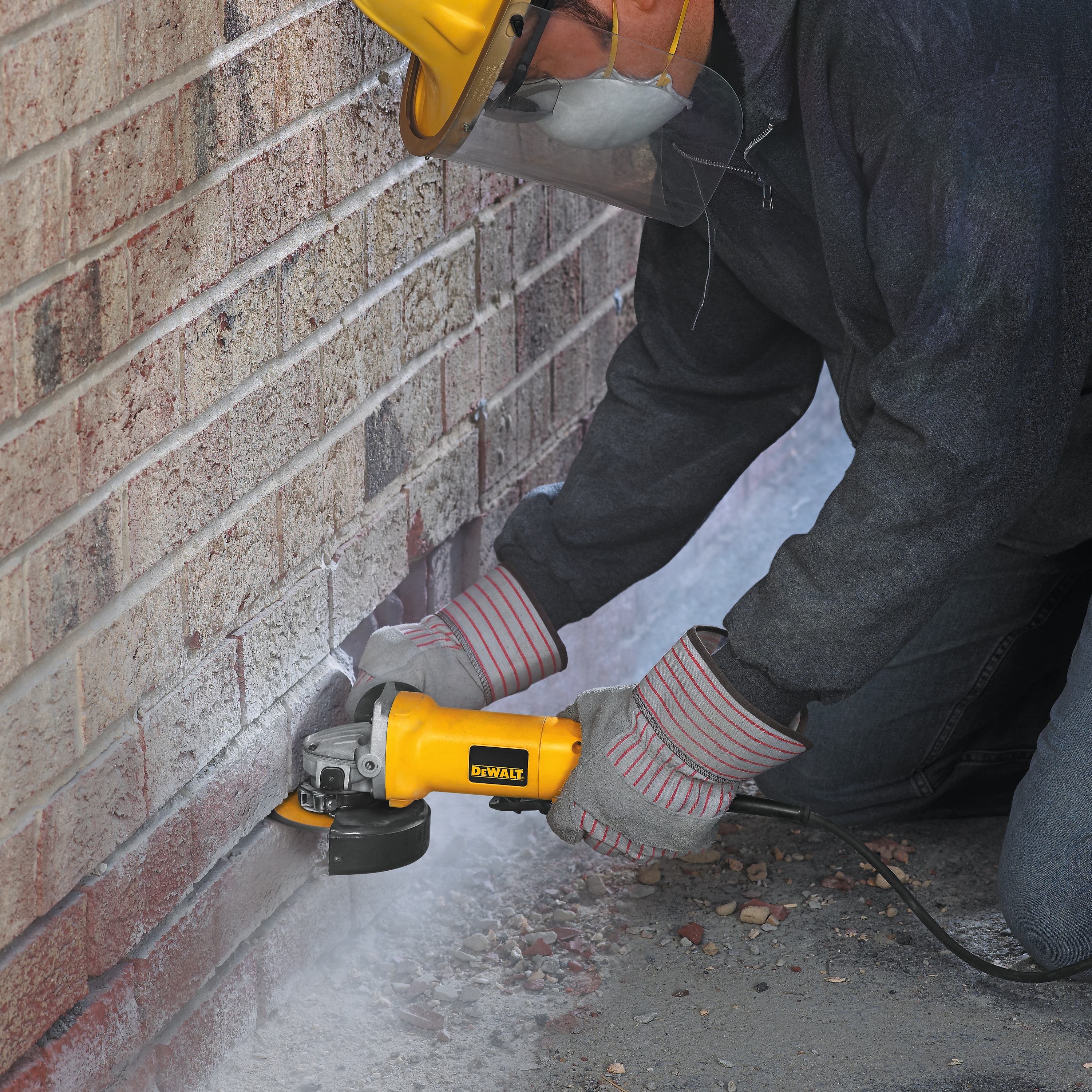 Small Angle Grinder being used on cut a metal pipe