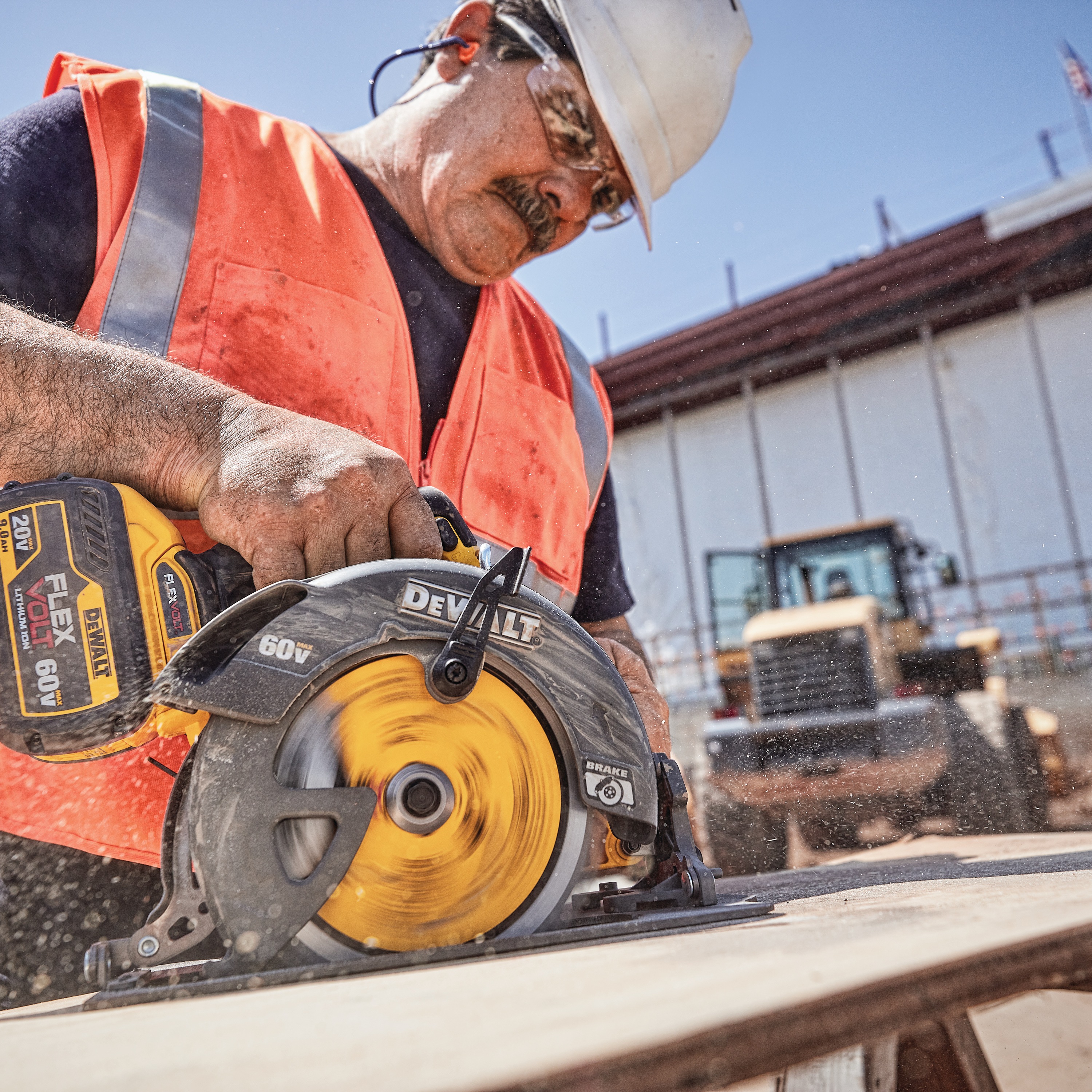 20 Volt to 60 Volt 9 AMP hours Lithium-Ion Battery-powered Circular Saw being used by a construction worker to cut a wooden sheet at a construction site
