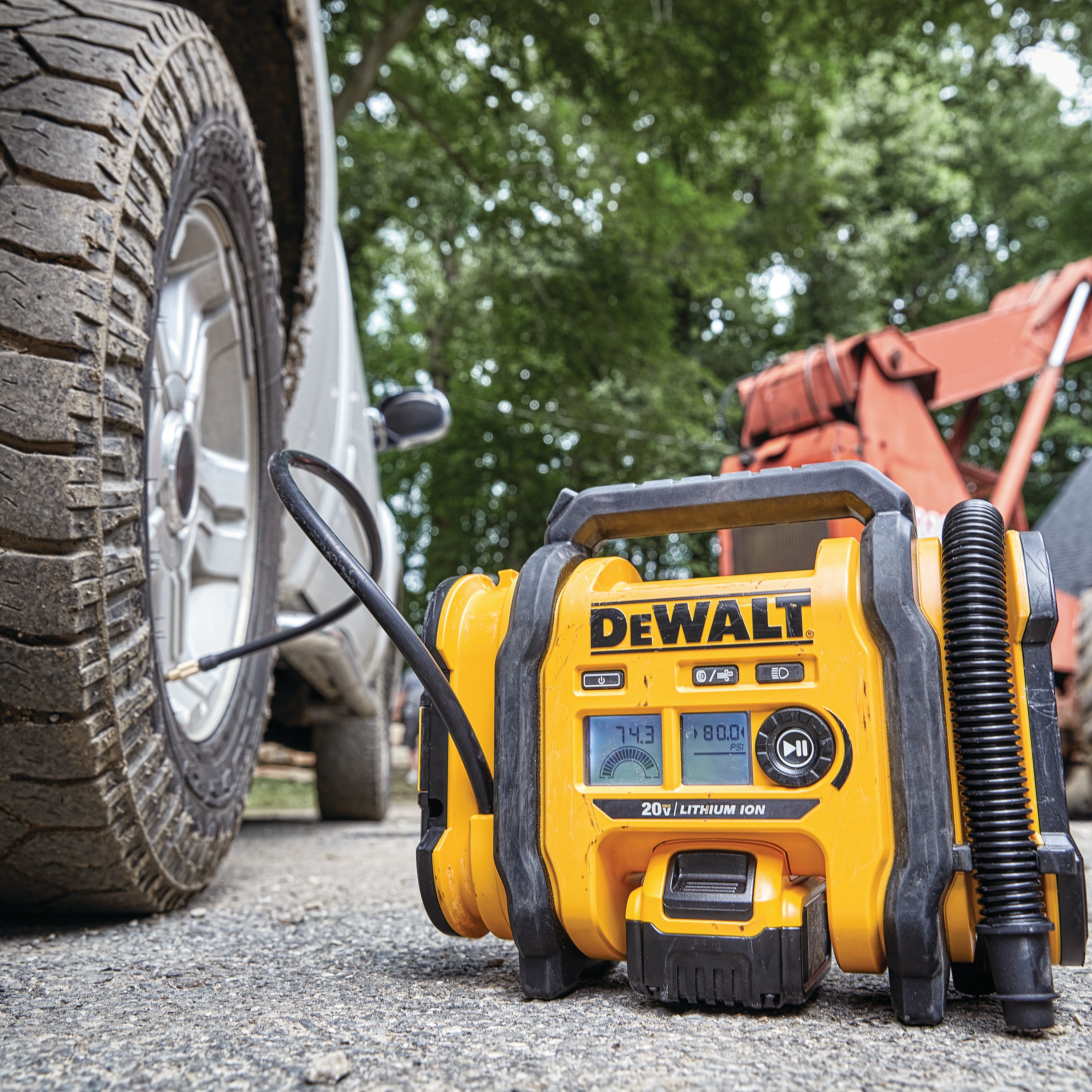 Corded/Cordless Air Inflator being used to inflate a vehicle tire