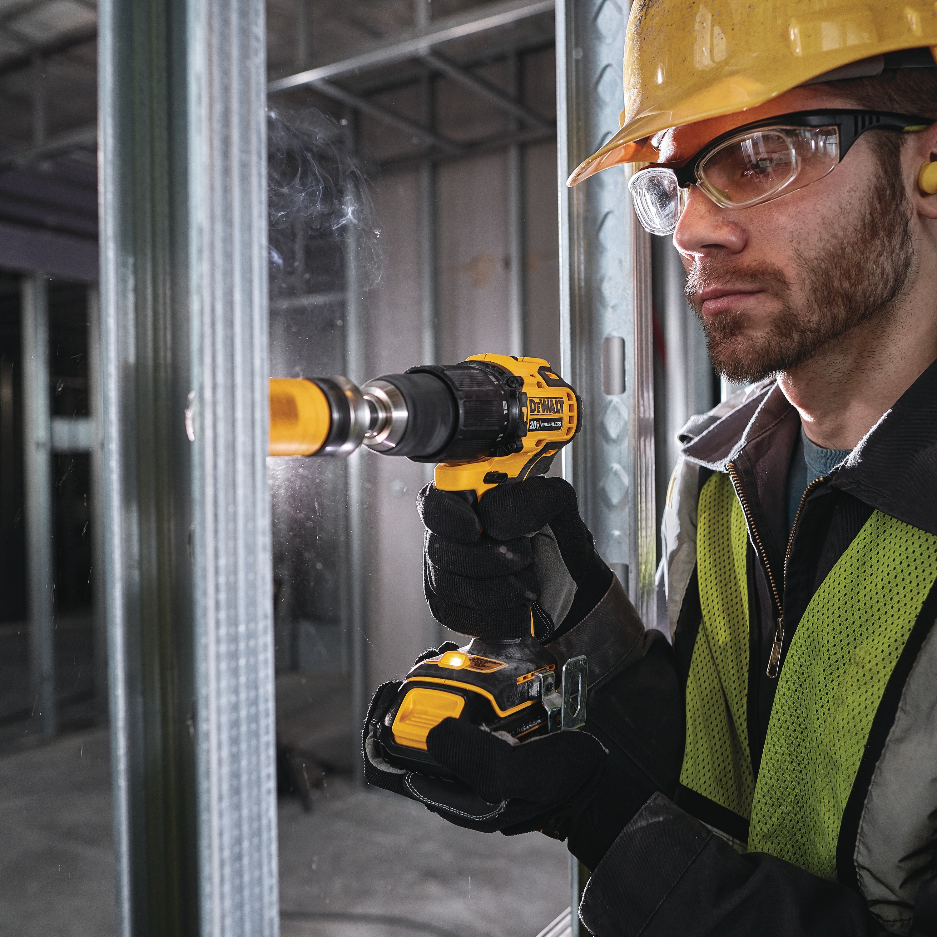 ATOMIC Brushless Compact Cordless half inch Hammer drill driver  being used by a person.