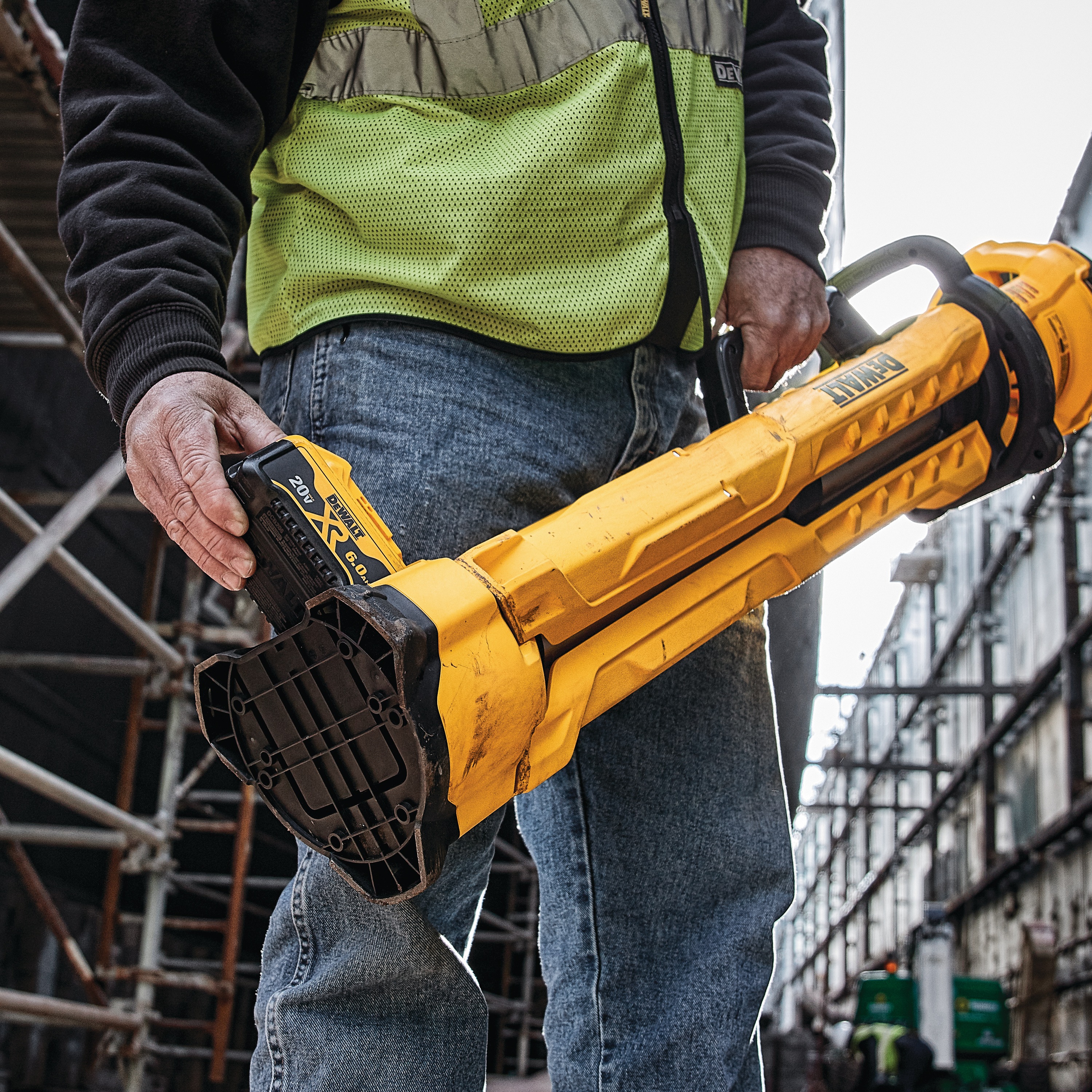 cordless tripod light being used by a construction worker in protective gear