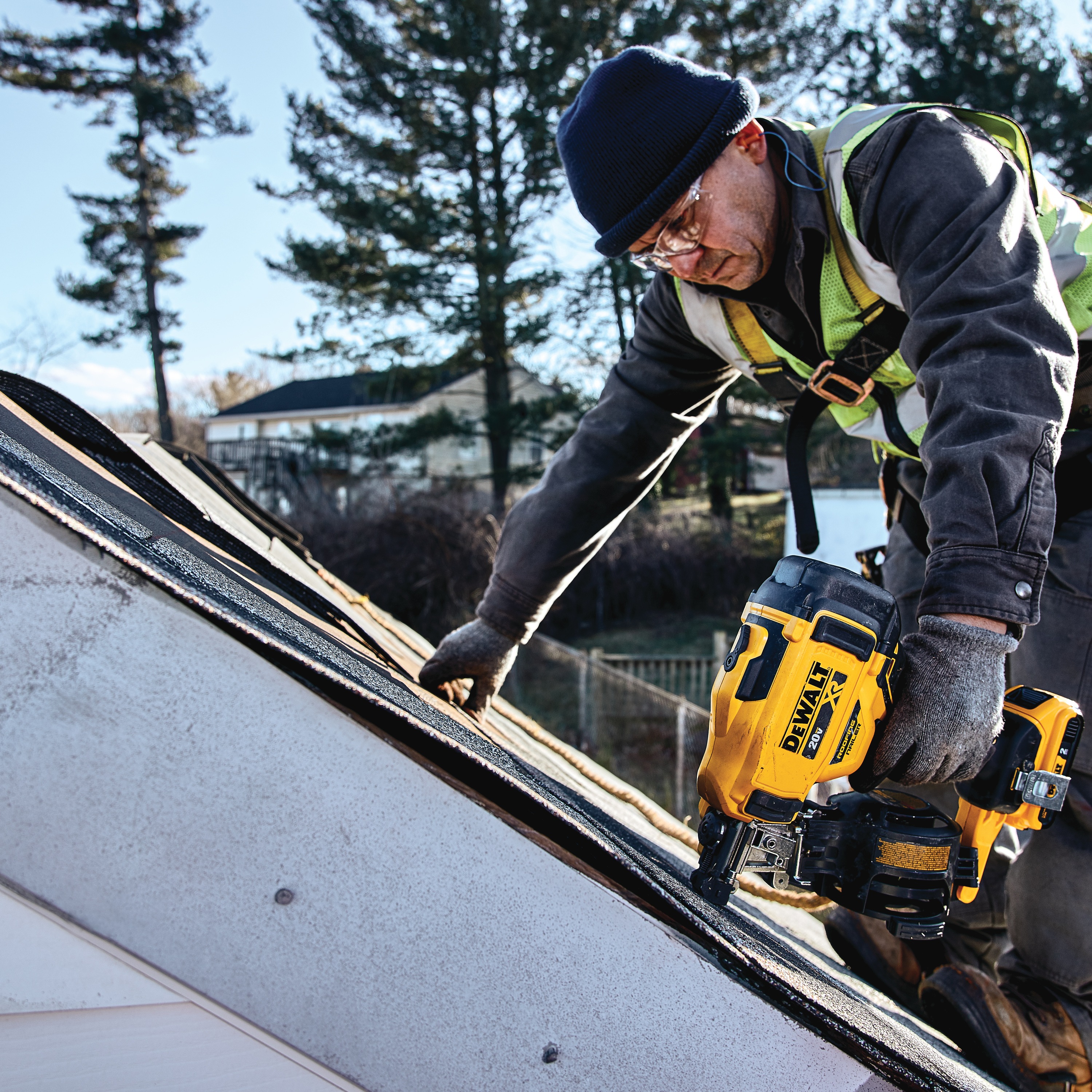 Cordless Coil Roofing Nailer being used by a construction worker on a roof