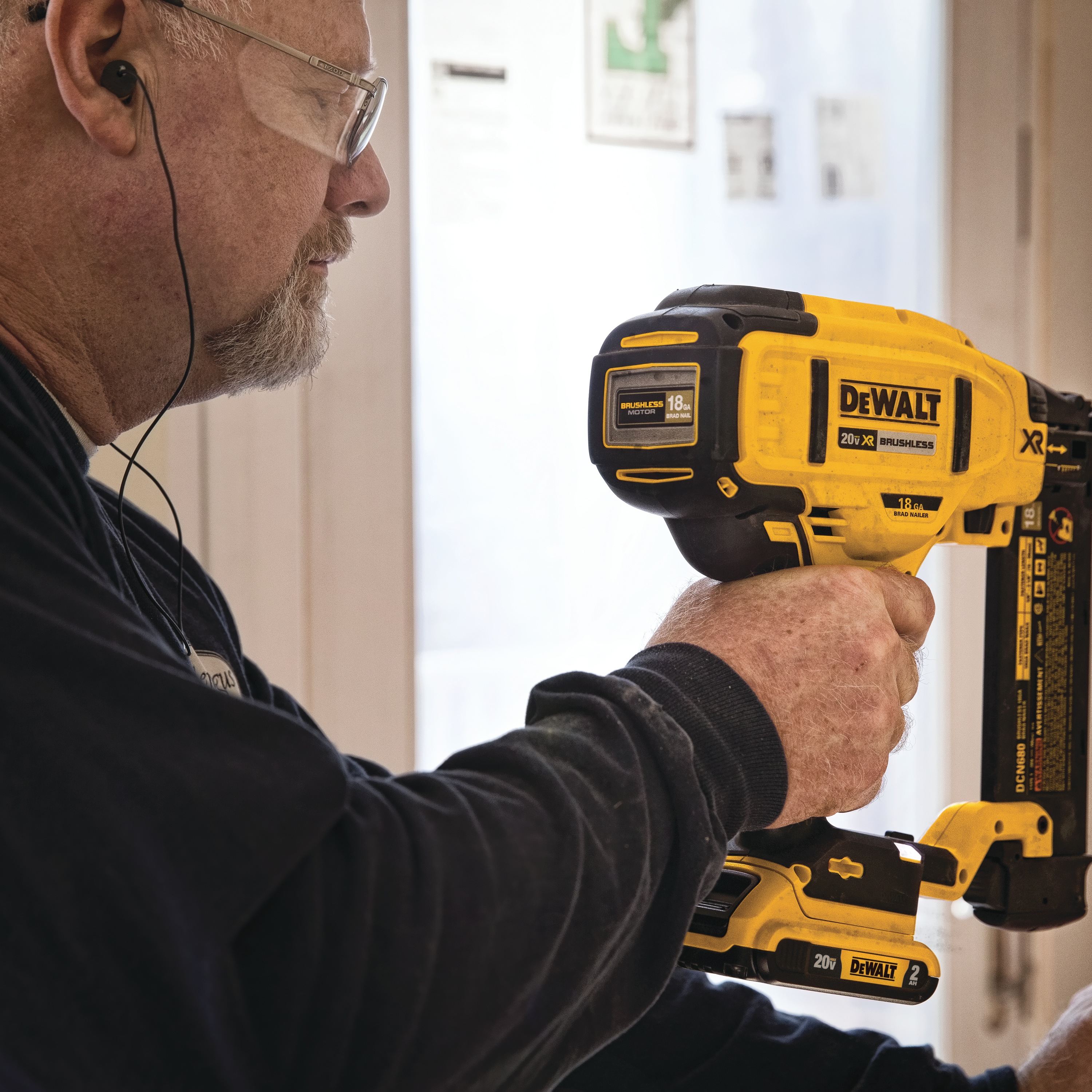 XR 18 gauge Cordless Brad Nailer in action by a construction worker on frame