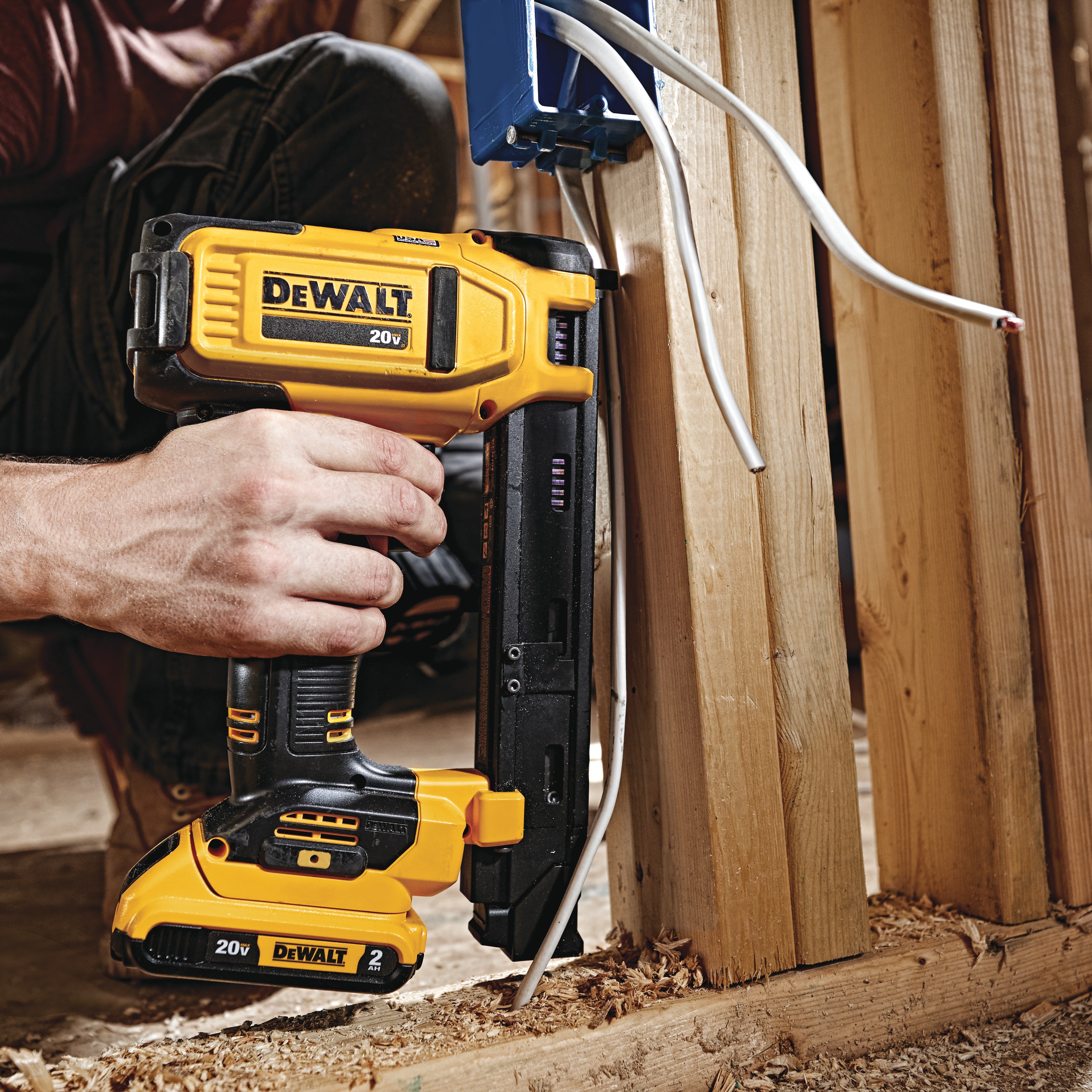 Cordless Cable Stapler in action on a wooden pillar
