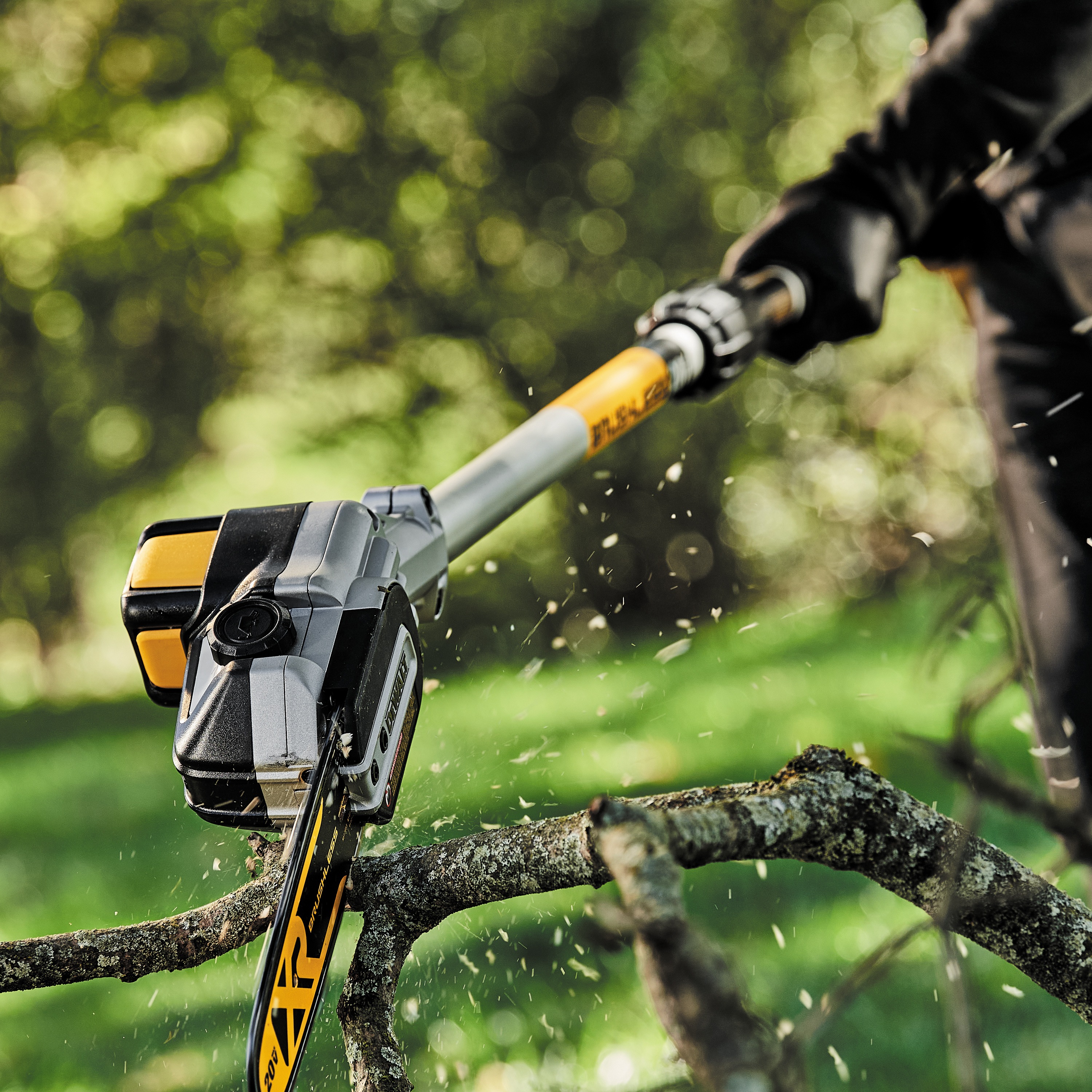 Brushless Cordless Pole Saw pruning branches.