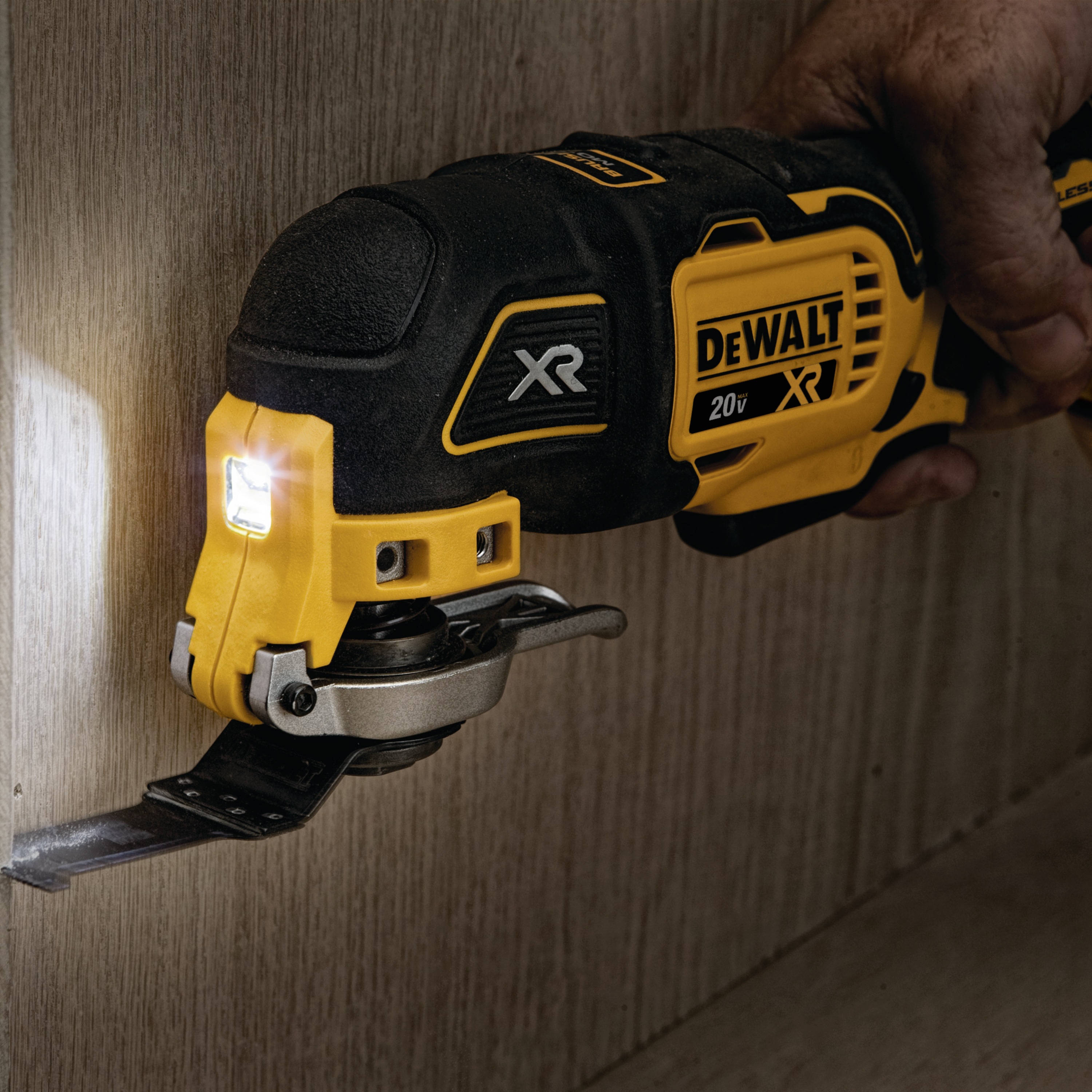 XR Cordless Oscillating Multi Tool being used by person to slice through a wooden surface