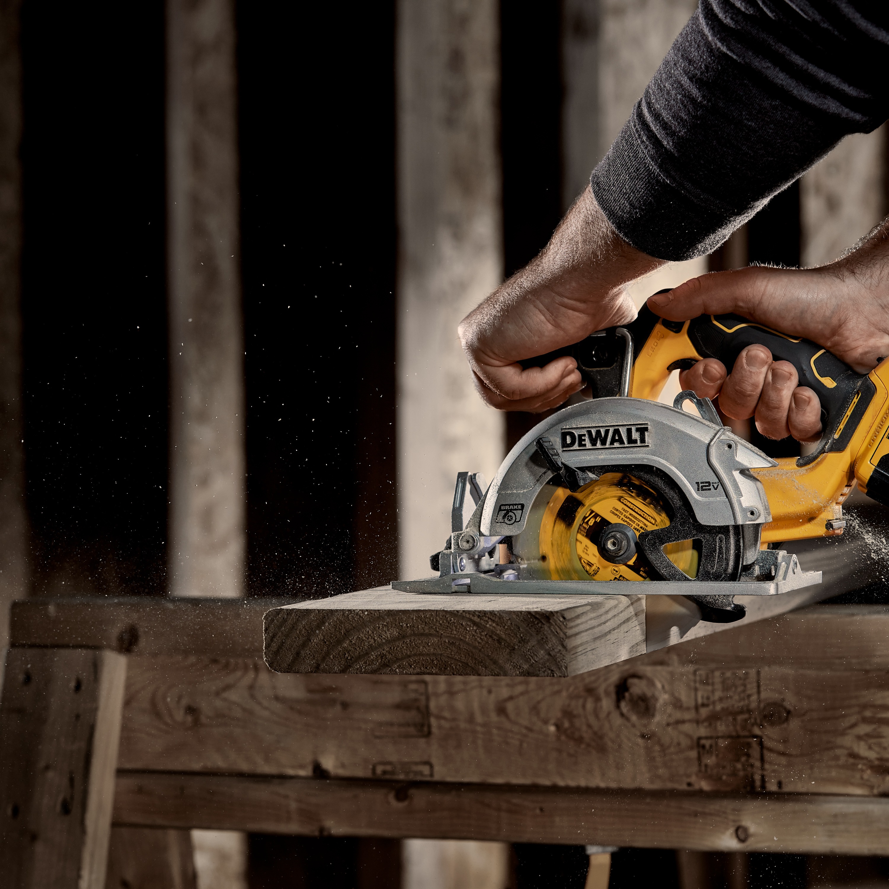 Xtreme 12 volt 5 and three eighths inch brushless cordless circular saw tool being used to cut wood.