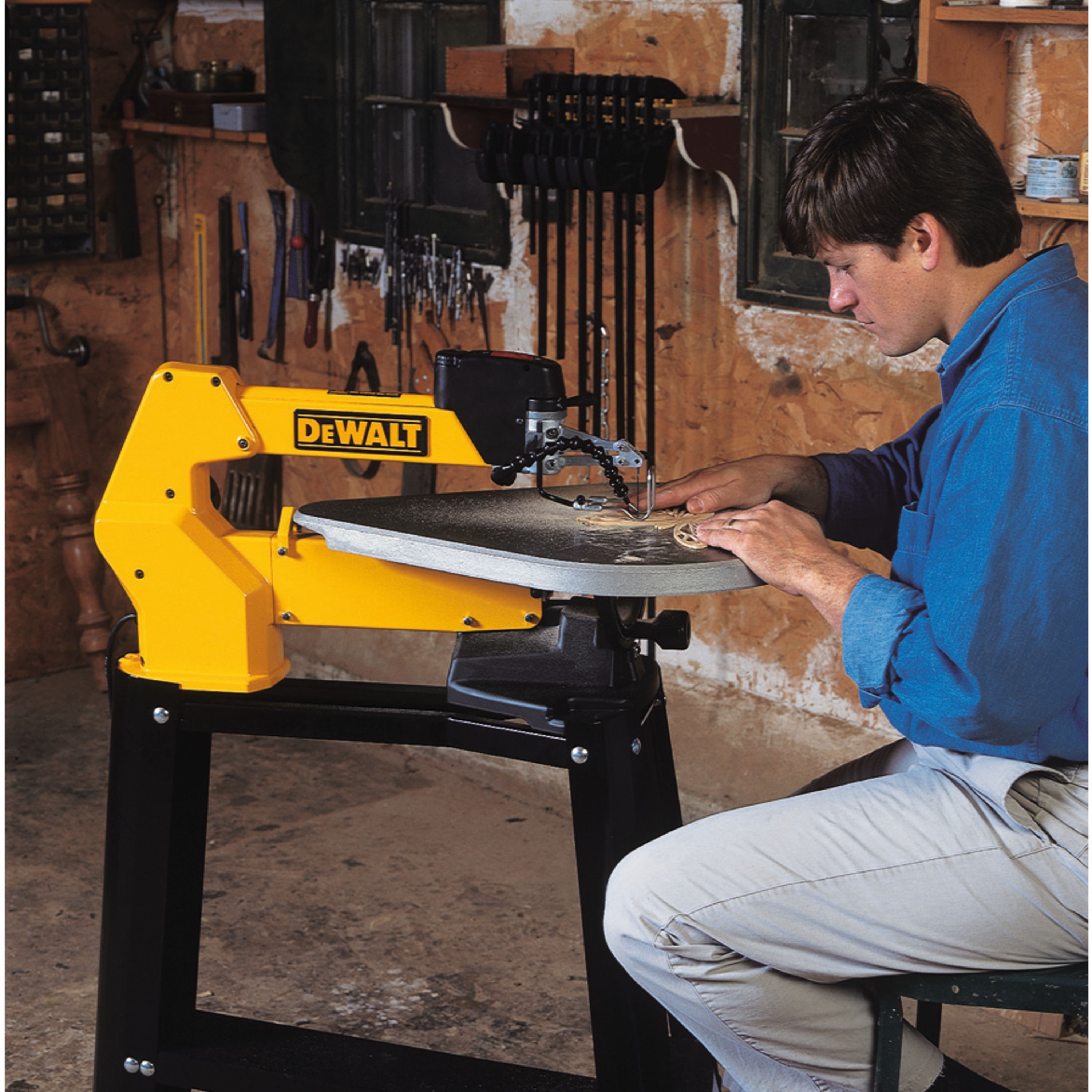 20 inch Variable Speed Scroll Saw being used by person.