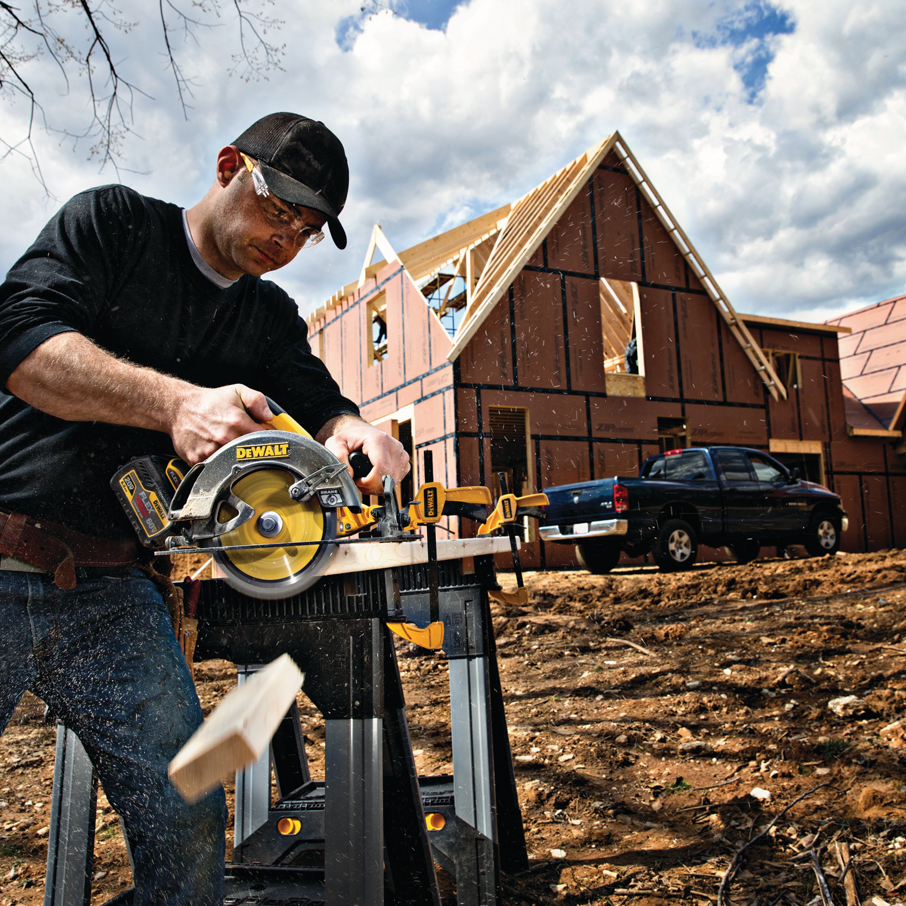 FLEXVOLT 7-quarter inch circular saw blade being used by a person outdoors.