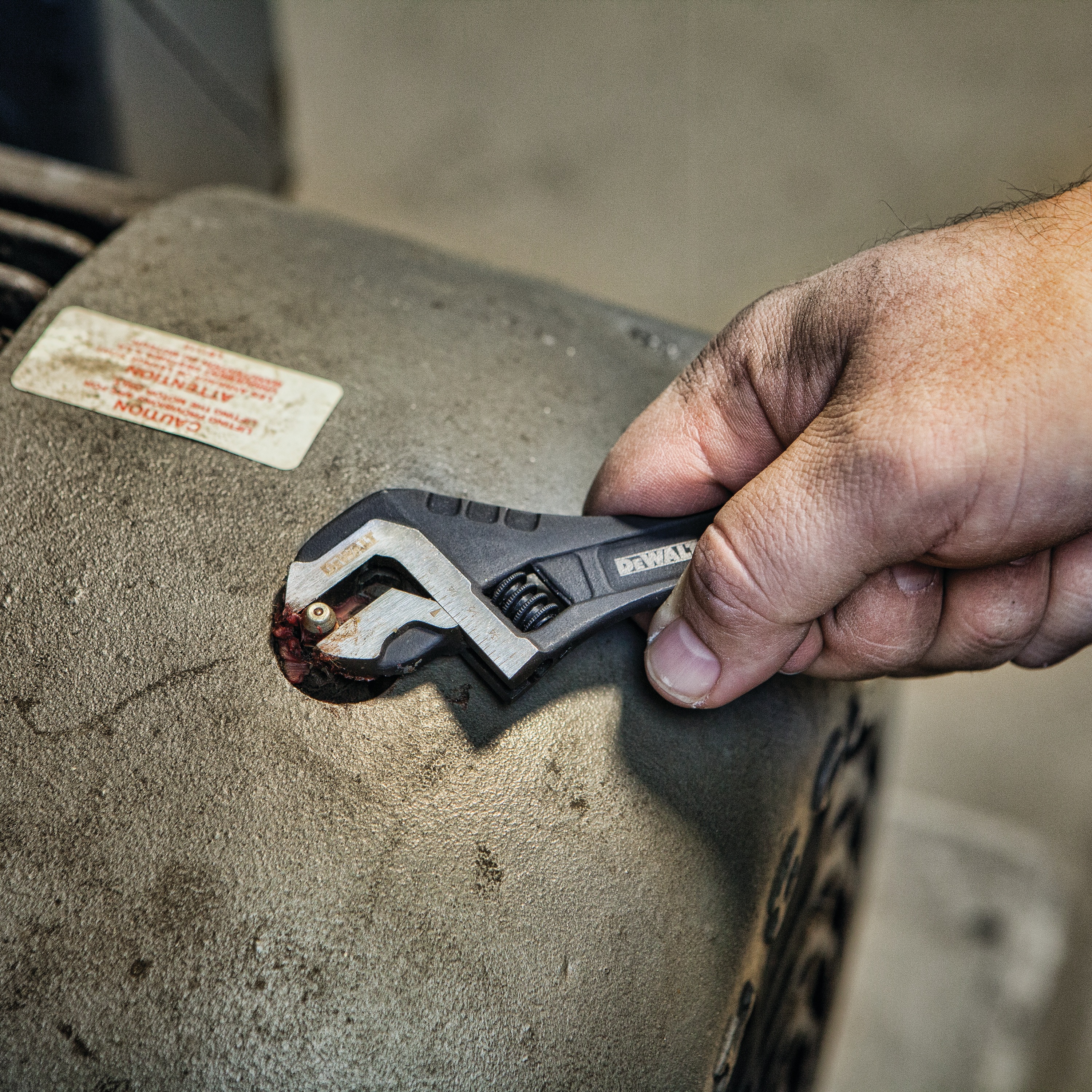 Close up of  6 inch All Steel Adjustable Wrench being used to adjust screws.