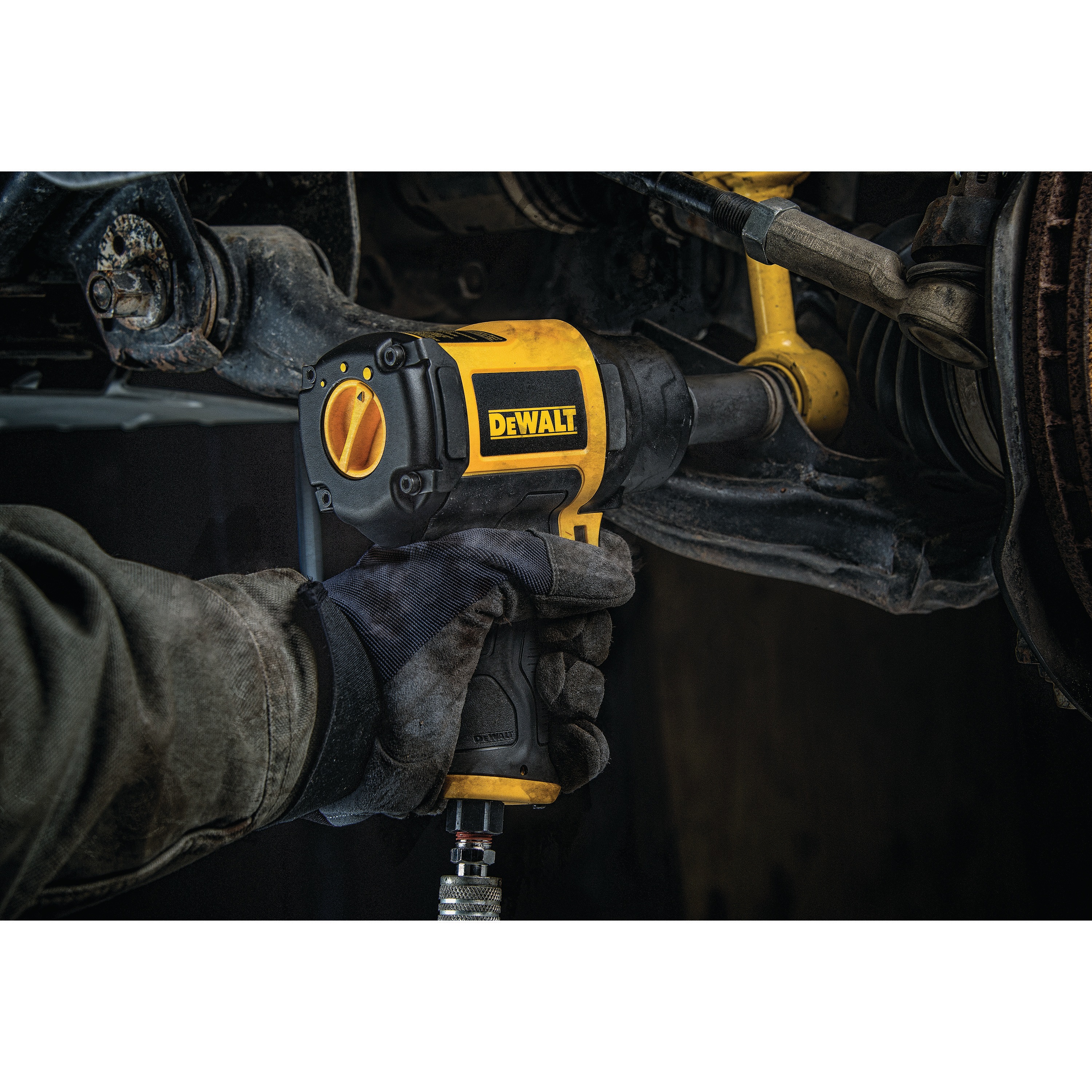 DEWALT half inch heavy duty drive impact wrench being used by a person. 