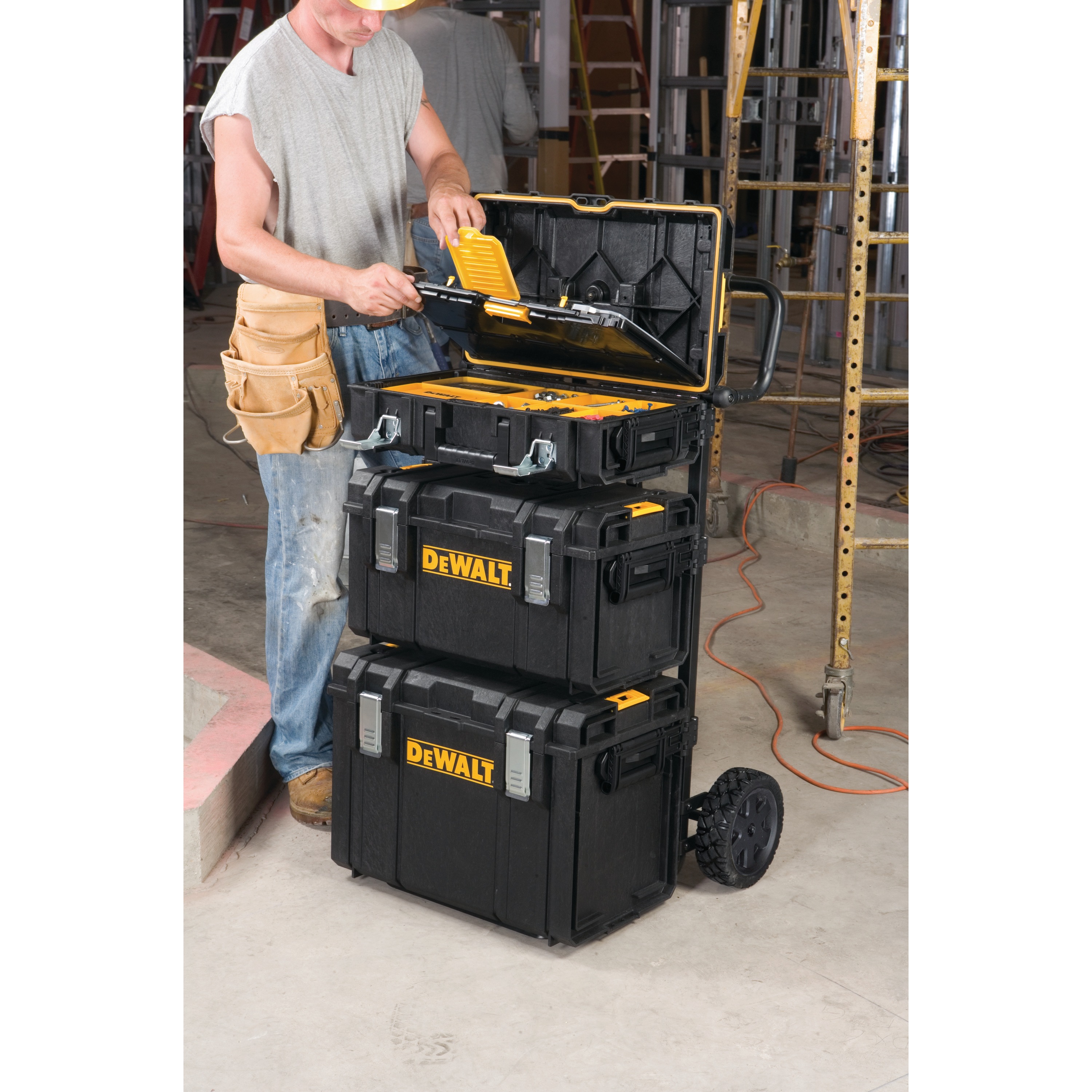 tough system DS carrier with three cases attached to it in use at a worksite.