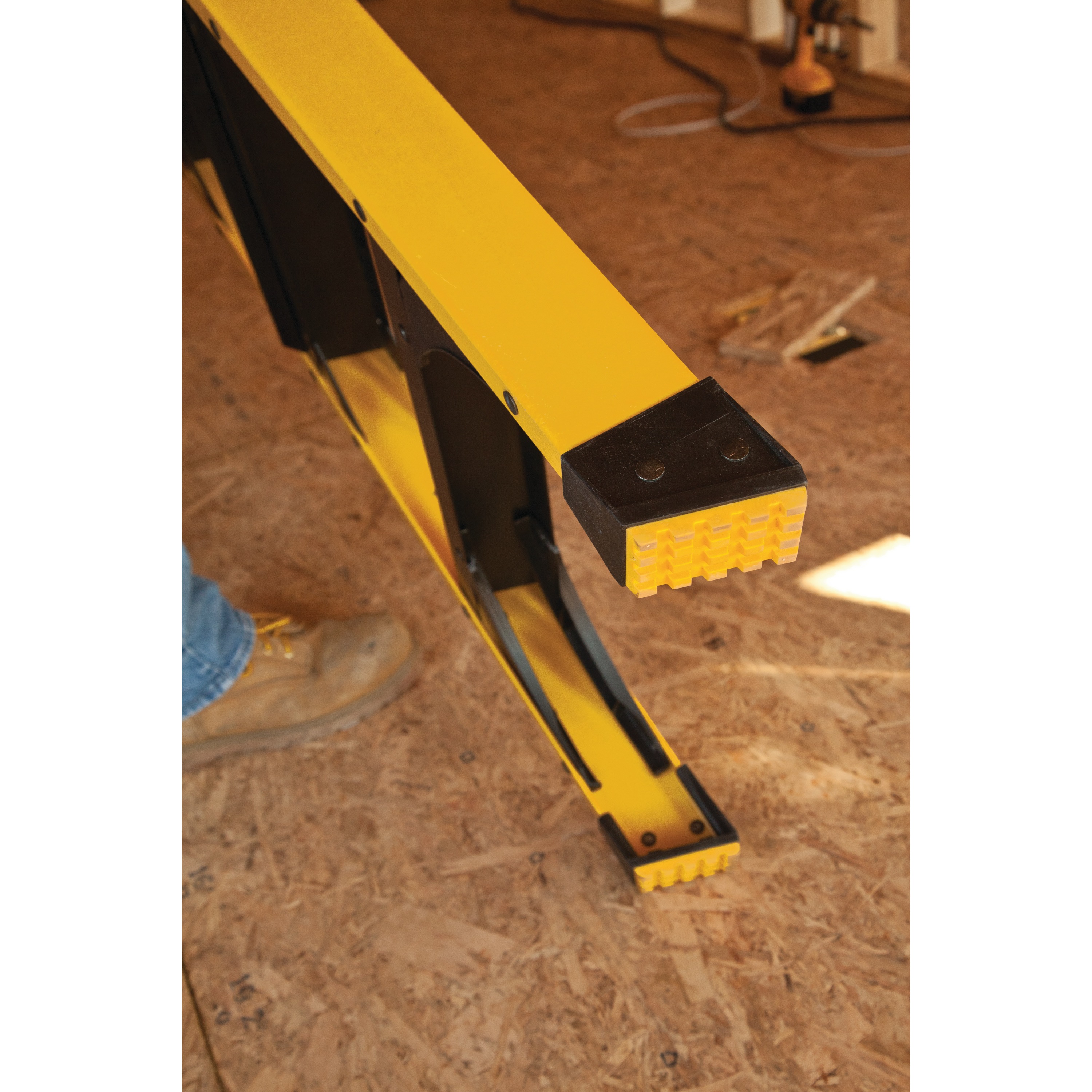 Slip resistant heavy duty boot feature of 10 foot Fiberglass Step Ladder 300 pound Load Capacity.
