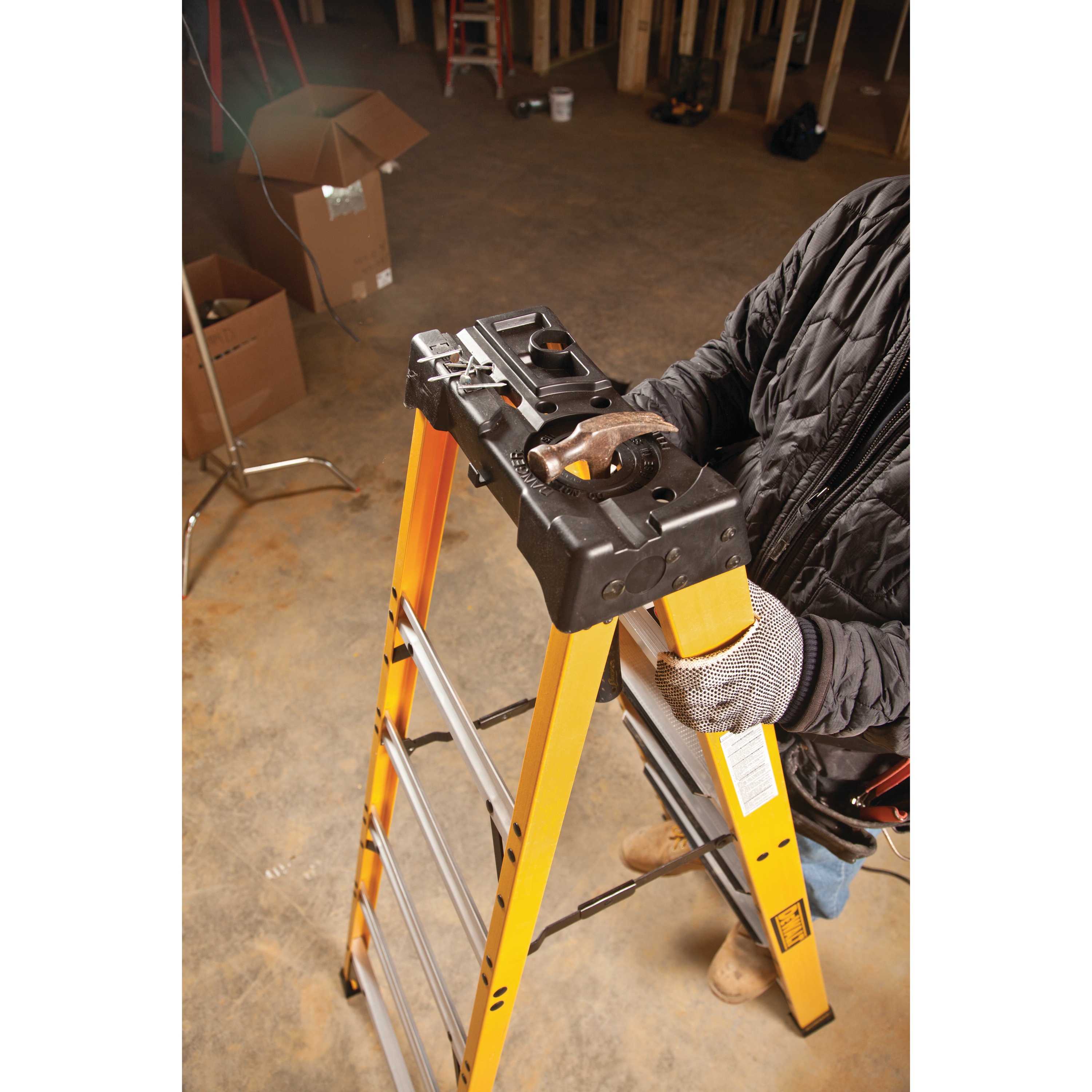 Durable top feature of 12 foot Fiberglass Step Ladder 300 pound Load Capacity.