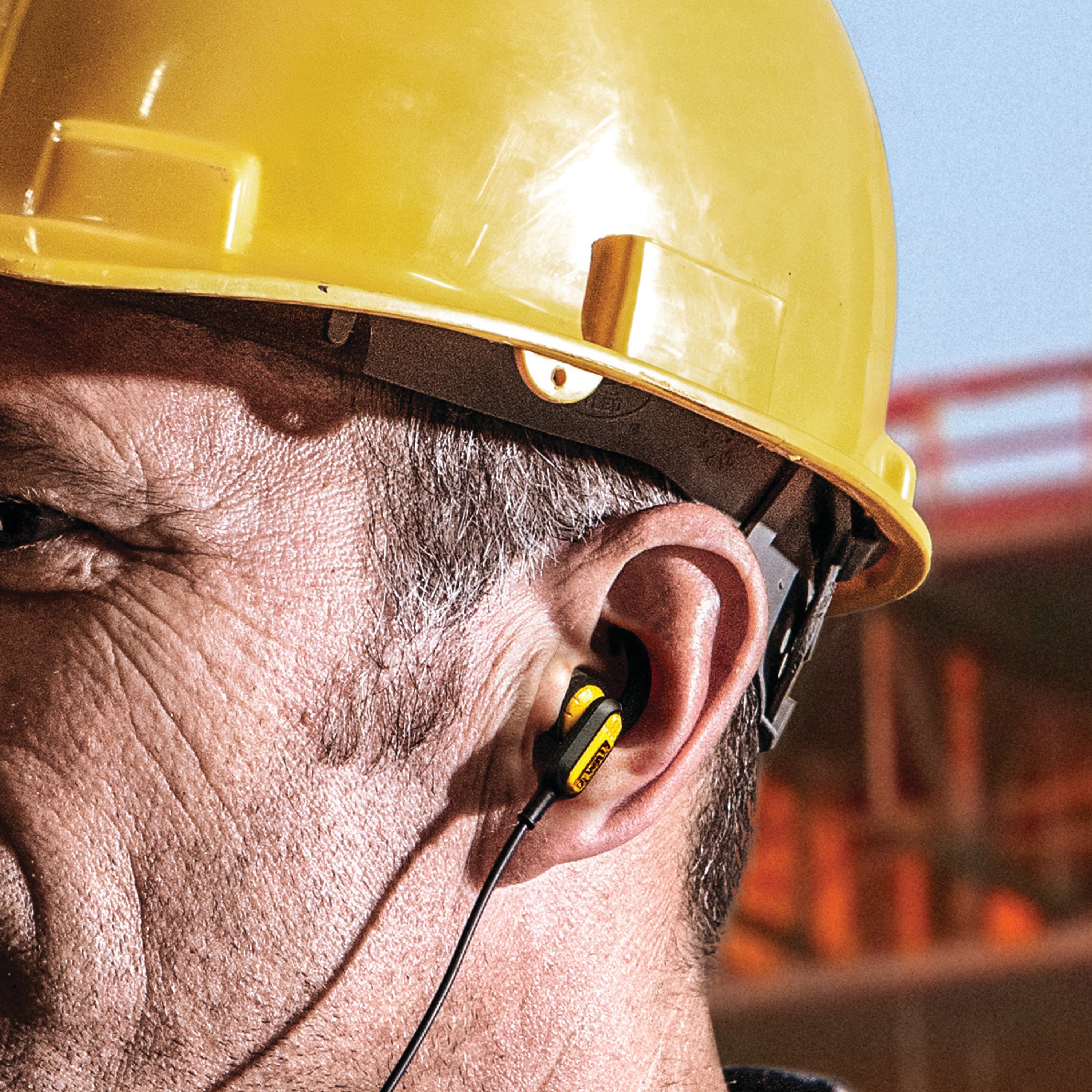 Jobsite Earphones for Lightning being used by a person.