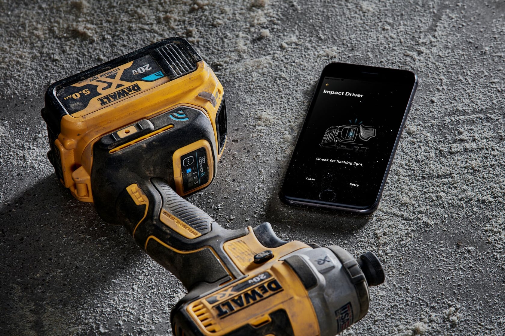 close up of Brushless Tool Connect  on the floor with a cellphone