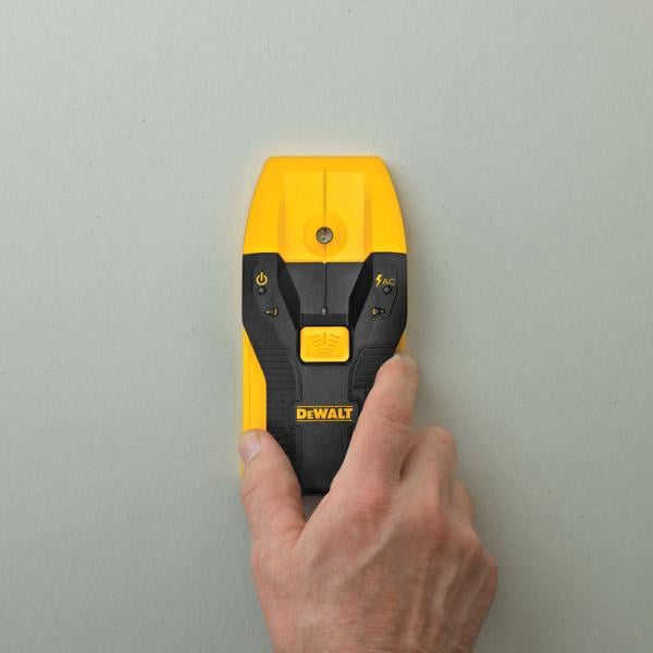 DEWALT stud finder being used to detect a stud.