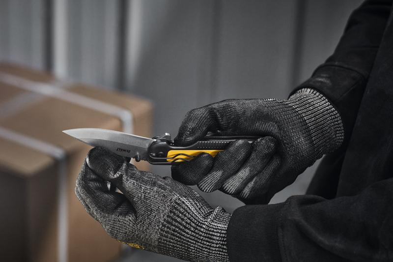 DEWALT pocket knife being opened by user