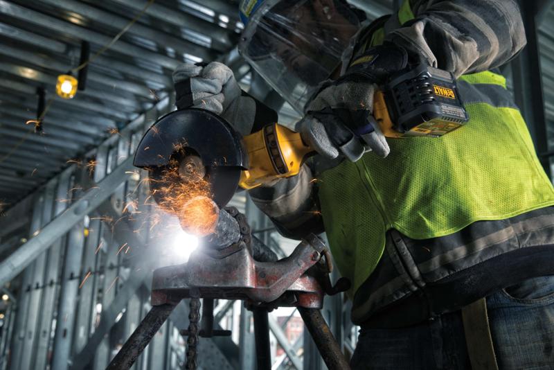 GRINDER 1 BATTERY with an abrasive wheen attachment in action