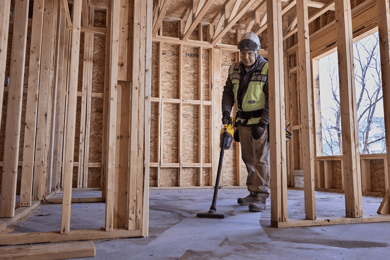 user vacuuming jobsite 
