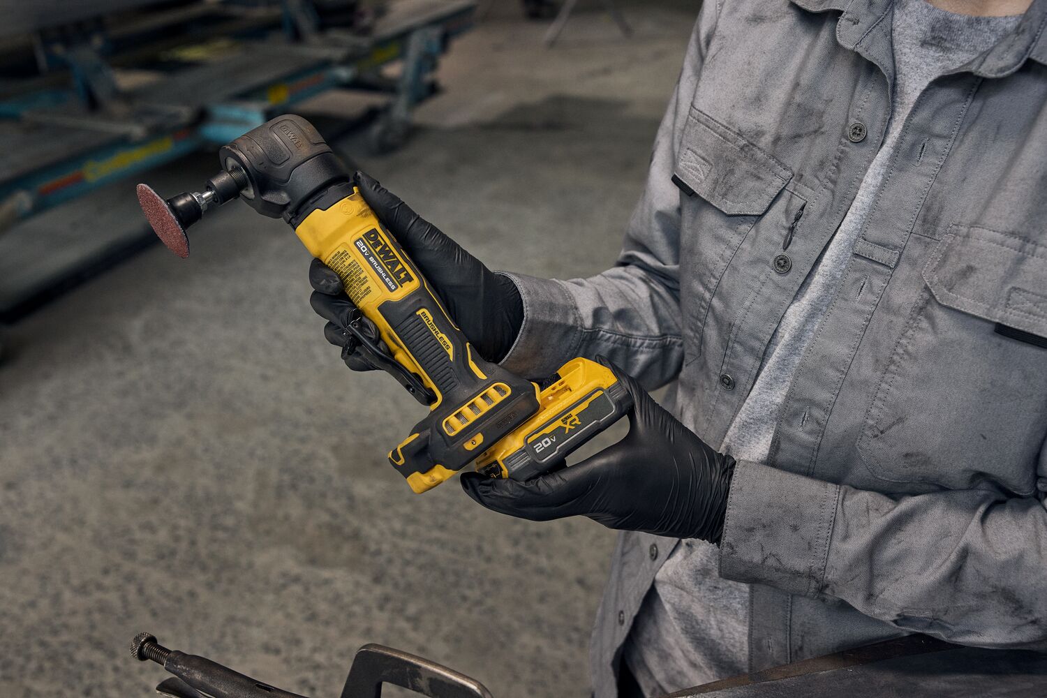 User putting battery on ATOMIC™ 20V MAX* Right Angle Die Grinder