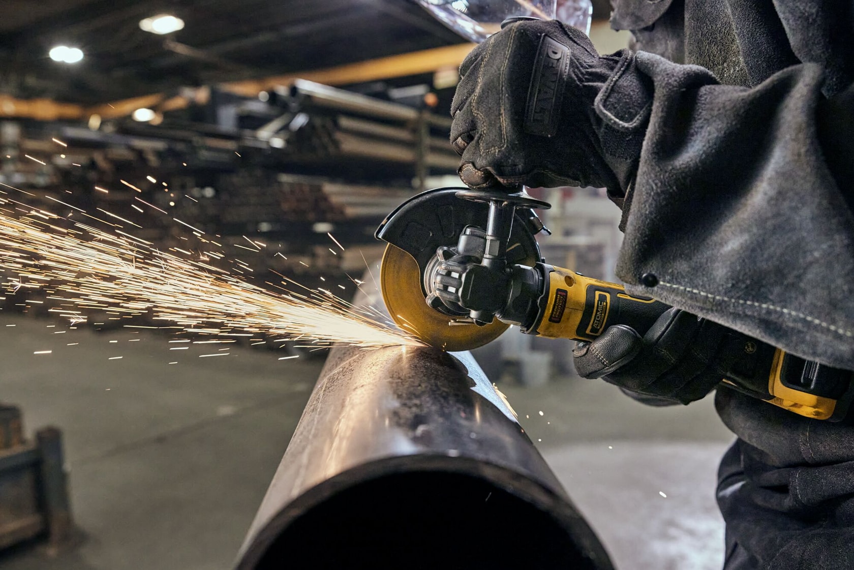 User cutting with ATOMIC™ 20V MAX* 4.5 in. Angle Grinder