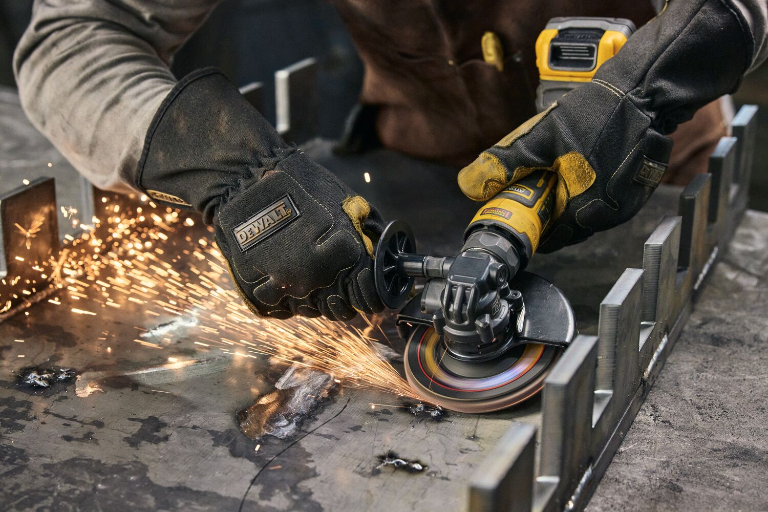 User grinding with ATOMIC™ 20V MAX* 4.5 in. Angle Grinder