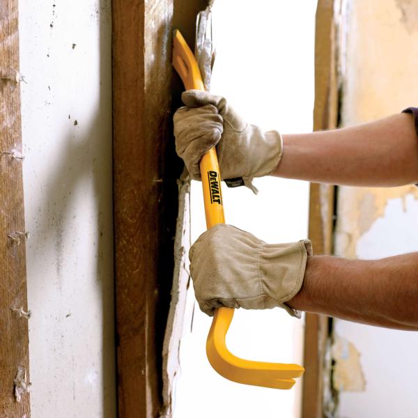 24 inch Wrecking Bar being used on wall.