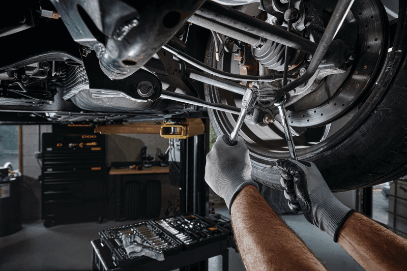 DEWALT 173 piece Mechanics tool set being used by a person.