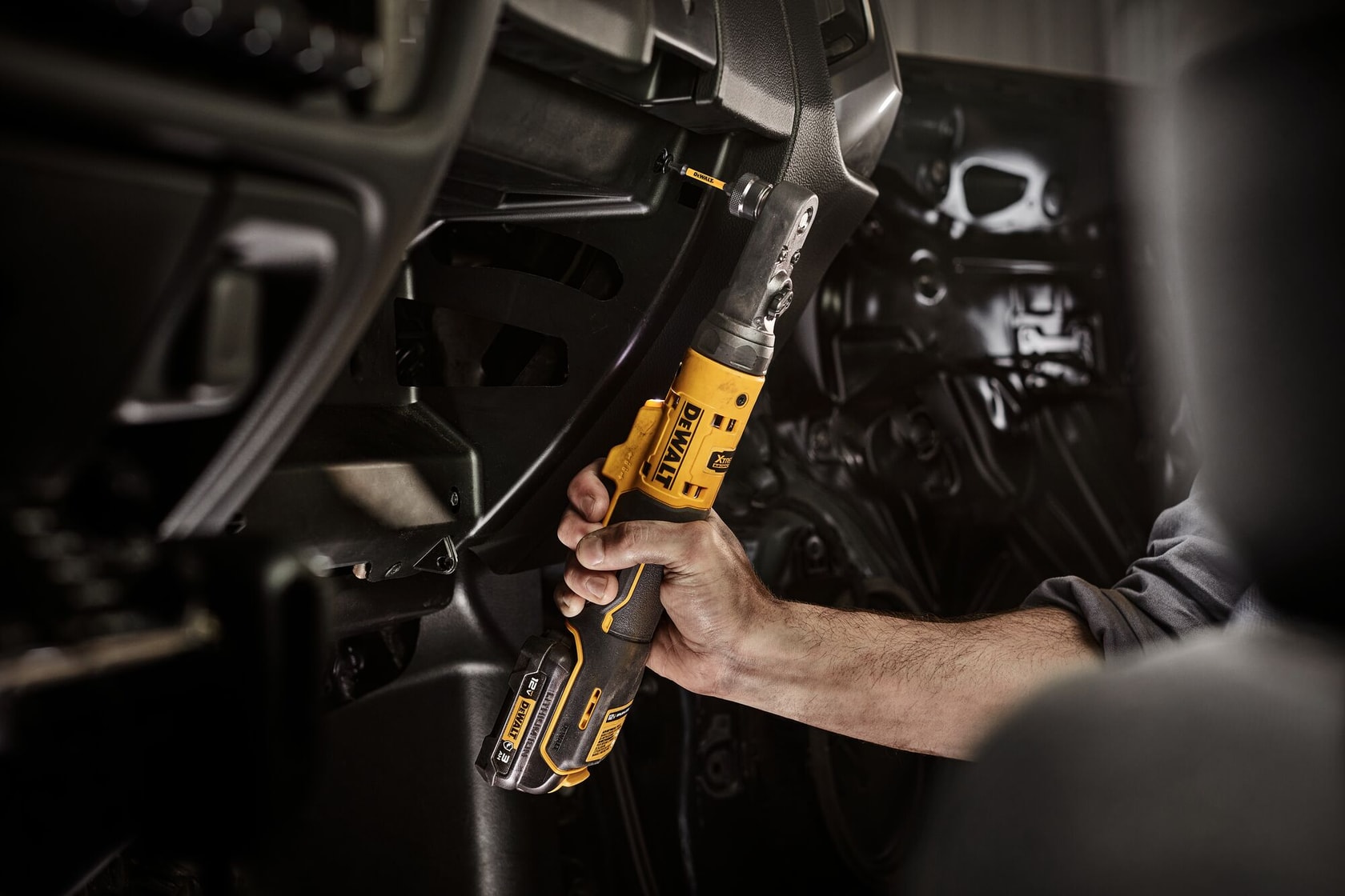 DCF500B XTREME 12V MAX Sealed Head Ratchet application image fastening with 1/4 inch quick change bit 