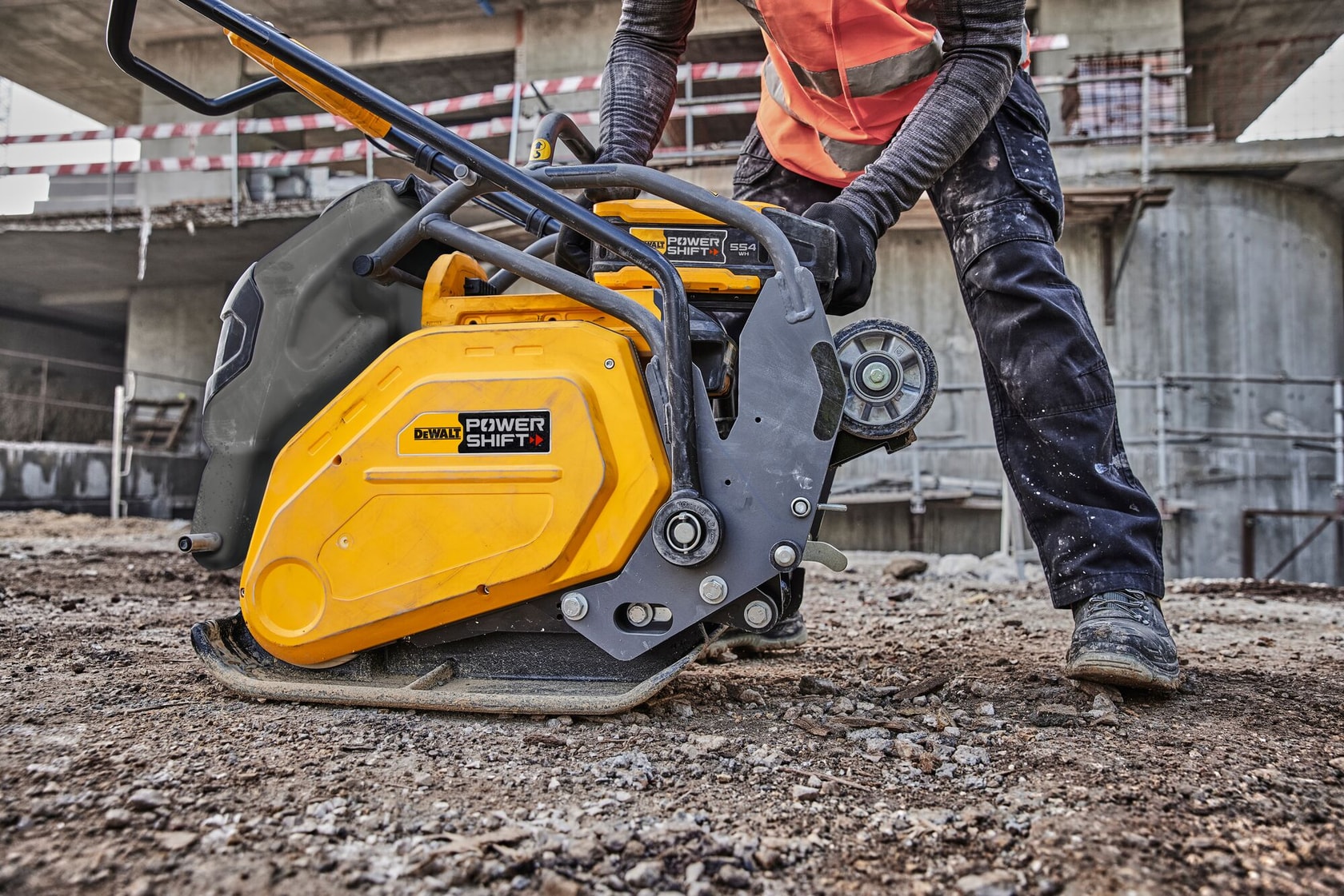Powershift battery DCBPS0554 being attached to Powershift Plate Compactor