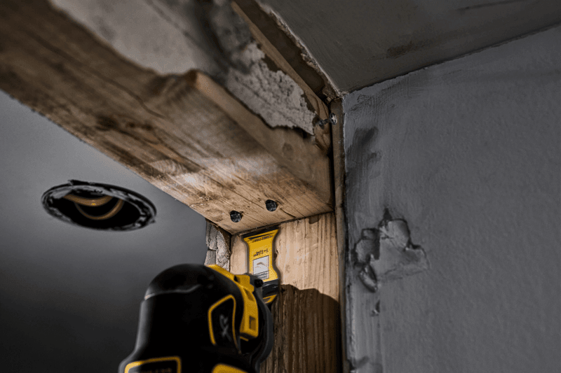 DEWALT Oscillating blade cutting nails through wood