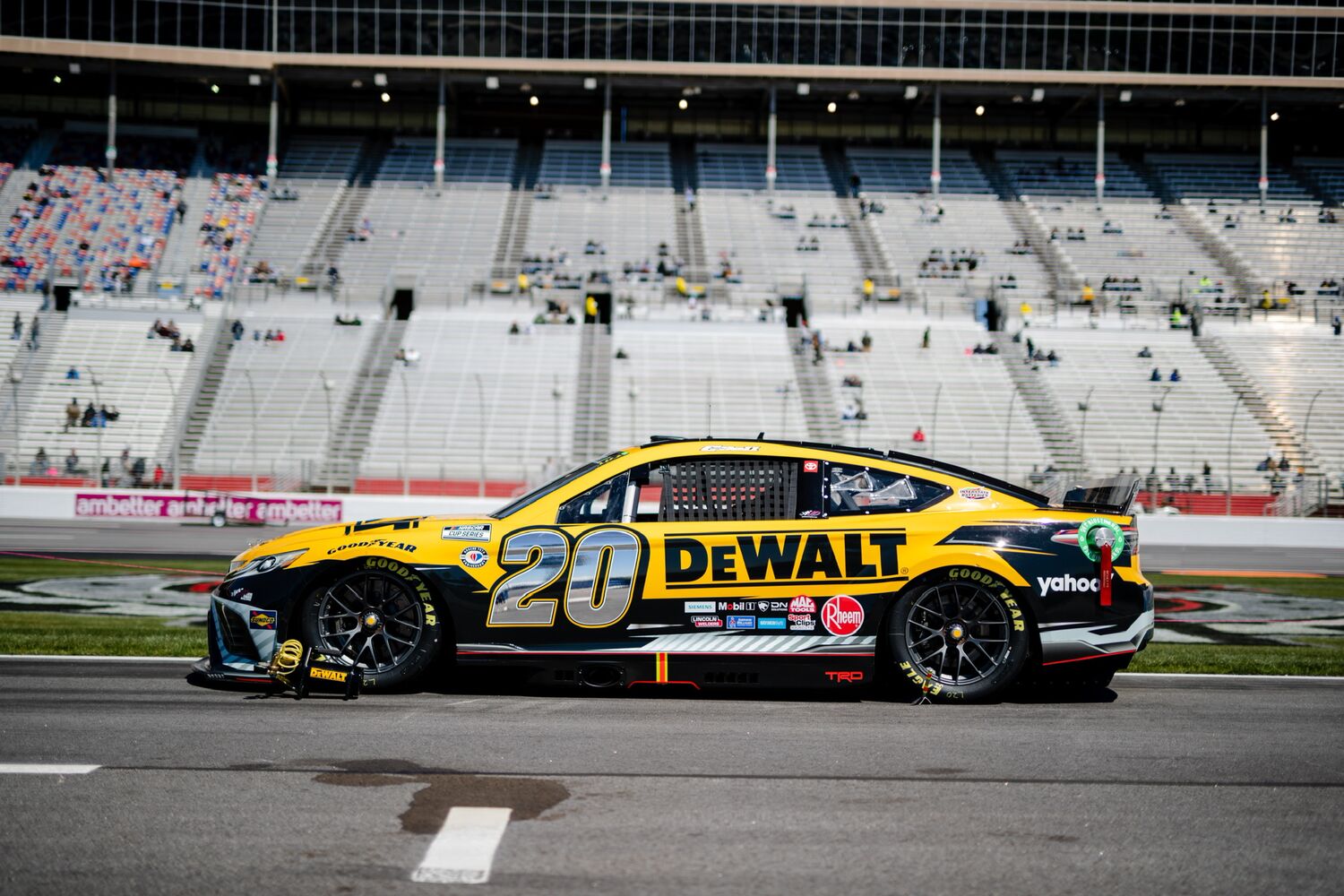 Shot of DEWALT number 20 car with JGR Racing  on a race track 