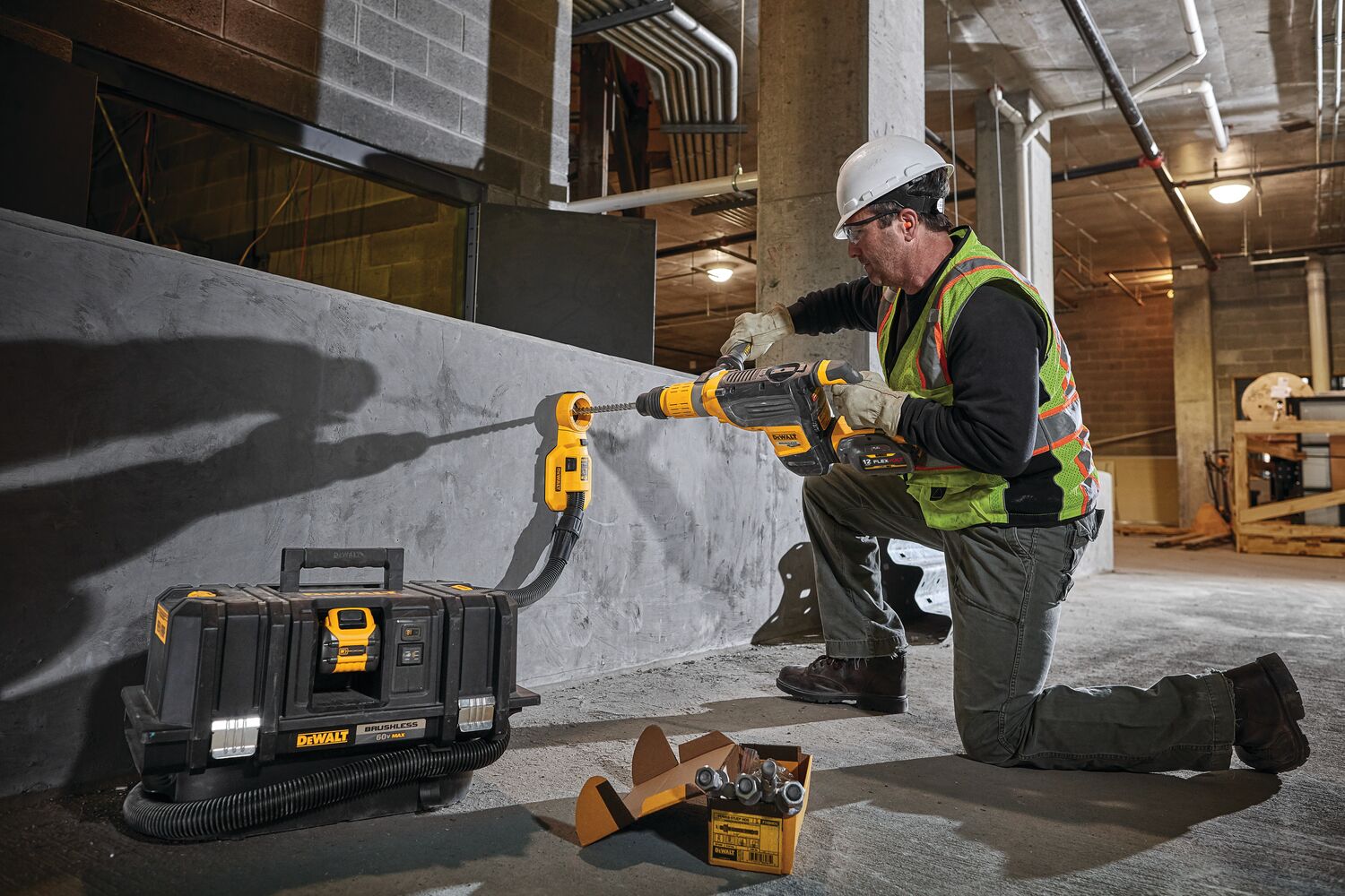 Brushless, cordless SDS MAX combination rotary hammer being used by a person