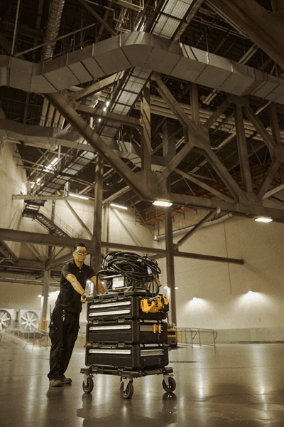 User rolling the TOUGHSYSTEM® 2.0 DXL™ 30 in Dolly through a hallway