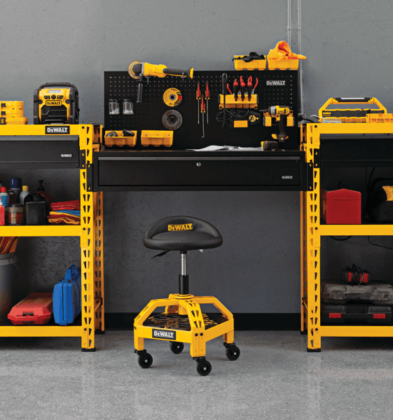 Adjustable Shop Stool with Casters in a work place with other tools on work stations.