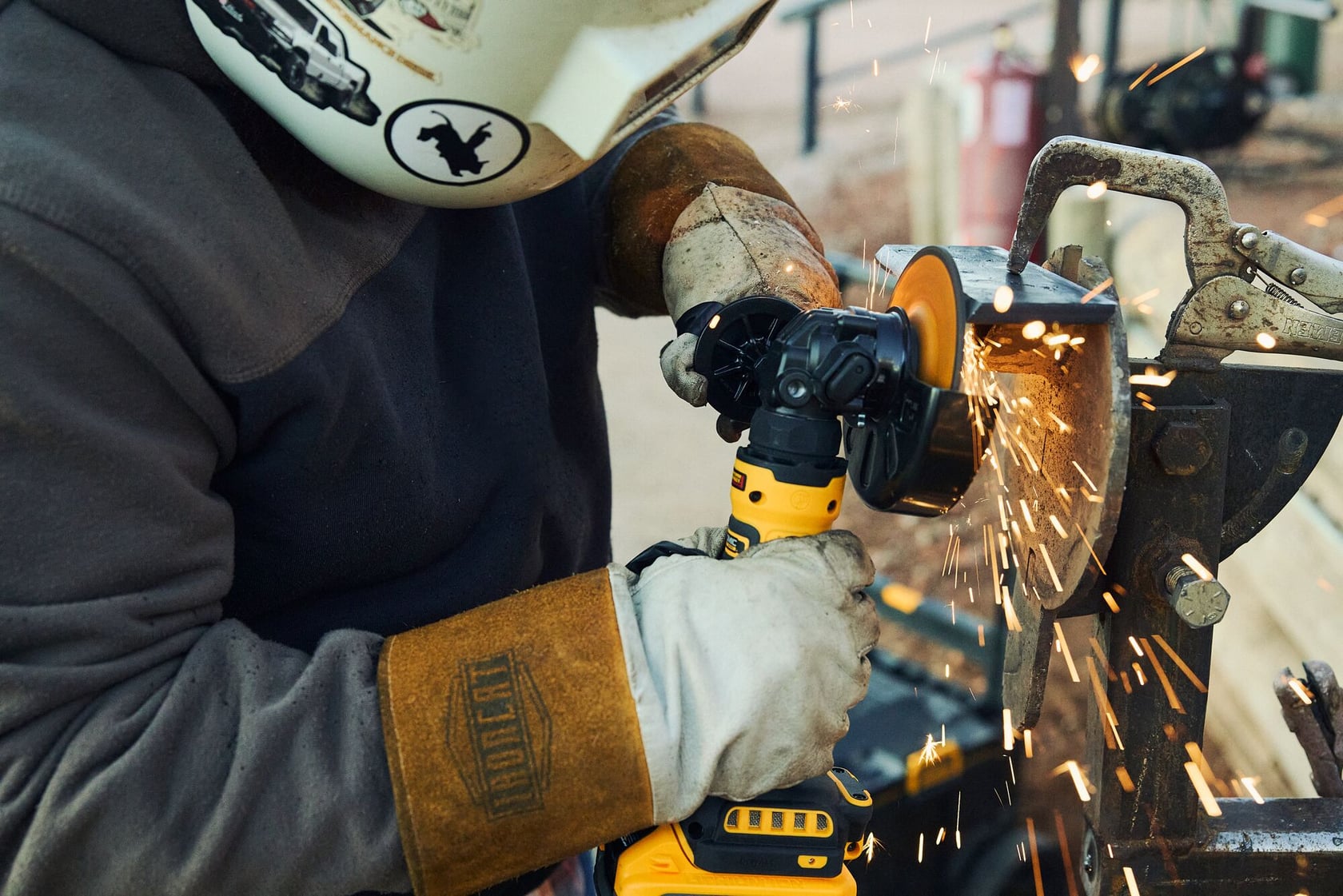 Student using DEWALT ATOMIC grinder at Western Welding Academy