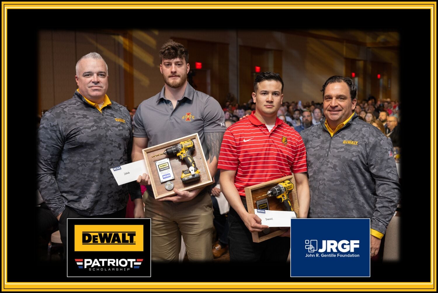 Four people standing together at an indoor event with blurred faces, two holding award plaques and DEWALT tools. The image features a crowd in the background and includes the DEWALT Patriot Scholarship logo and the John R. Gentille Foundation (JRGF) logo.
