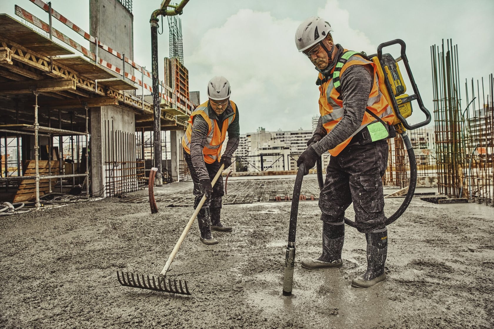 Man operating backpack vibrator